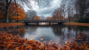A tranquil autumn scene with a bridge over a pond surrounded by vibrant orange leaves.

