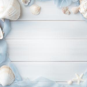 A tranquil beach-themed background with seashells and soft fabric on a light wooden surface. 

