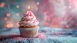 A lit cupcake with pink frosting and sprinkles on a colorful background.

