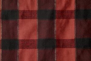 This image shows a close-up of a red and black plaid fabric, perfect for rustic-themed presentations. 

