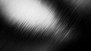 A sleek black and white abstract background with vertical streaks, perfect for modern presentations.

