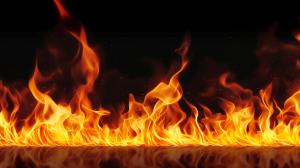 A vibrant image of flames against a black background, showcasing dynamic fire movement.

