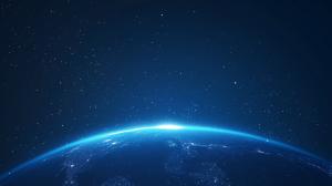 A breathtaking view of Earth from space, highlighting its curvature and starry backdrop. 

