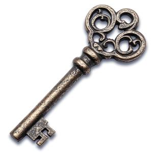 This image depicts an ornate old bronze door key with intricate designs.