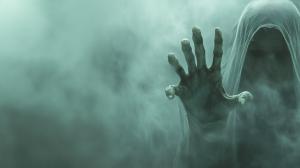 Download a ghostly figure reaching through fog, creating an eerie atmosphere for your presentation slides and media designs.