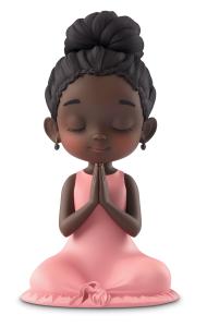 This image depicts a young girl with closed eyes, praying in a pink dress, symbolizing faith and spirituality.