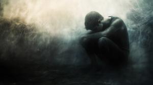 This image symbolizes despair and loneliness with a solitary figure in a misty background.