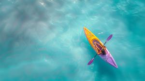 A vibrant kayak on turquoise waters, symbolizing adventure and outdoor exploration.

