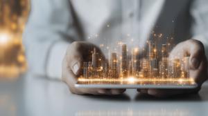 This image features a glowing digital city skyline displayed on a tablet, symbolizing business innovation.

