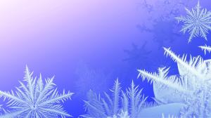 This image features intricate frost patterns on a cool gradient background, evoking a serene winter atmosphere.