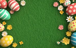 This colorful Easter background features decorated eggs and flowers on lush green grass.