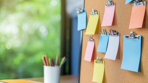 A bulletin board with colorful sticky notes, perfect for showcasing organization and productivity themes.

