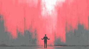 This image features a person in a suit gesturing toward a pink and gray wall, symbolizing business communication and inspiration.

