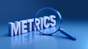 This image showcases the word &quot;METRICS&quot; with a magnifying glass, symbolizing business data analysis.

