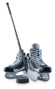 This image showcases hockey skates, a stick, and a puck, representing the sport of hockey.