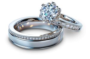 Download diamond wedding rings PNG clipart symbolizing eternal love and commitment. Perfect for wedding, engagement, and romantic presentation themes.