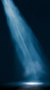  
This background features an illuminated stage floor, evoking anticipation and creativity.

