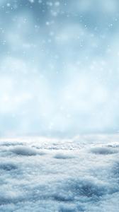  
This serene winter background features soft blue tones and falling snowflakes, perfect for seasonal presentations.

