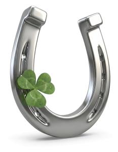 Download this Presentation Clipart featuring a lucky horseshoe and shamrock for St. Patrick's Day themes.