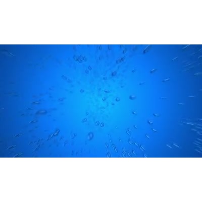 Water droplets fall towards the camera from a blue background.