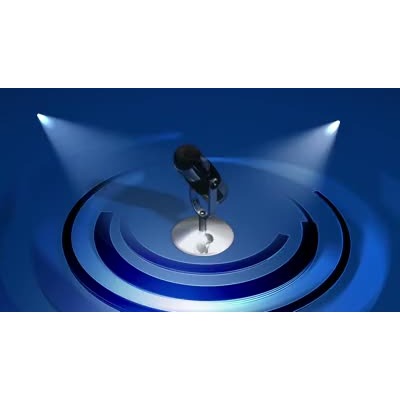 An old-fashioned microphone rotates around while spotlights shine on it.