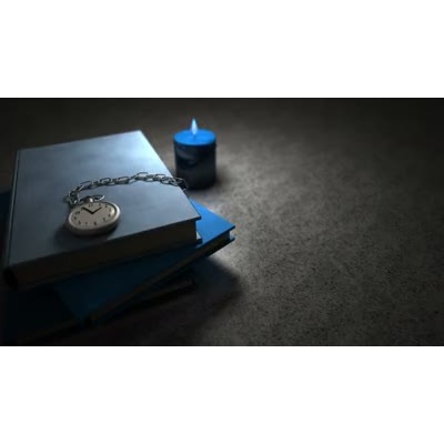 The light from a candle flame flickers over a stack of books and a pocket watch.