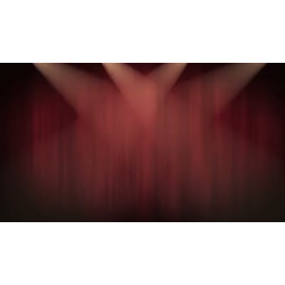 Stage spotlights move back and forth on a red theater curtain.