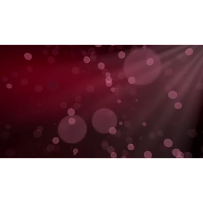 Particles of dust float in a beam of shimmering light.