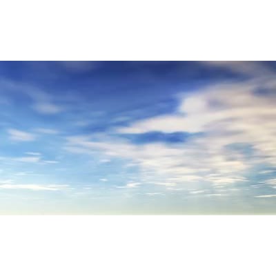 A blimp flies by high in the sky.