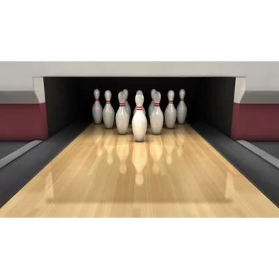 A strike is scored at a lane in a bowling alley.