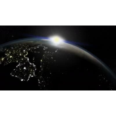 As the world spins from night to day we can see brilliant city lights on the dark side.