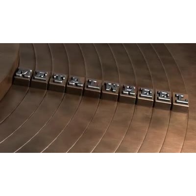 In this custom video a group of concentric ring swing around to line-up a row of metal letters.