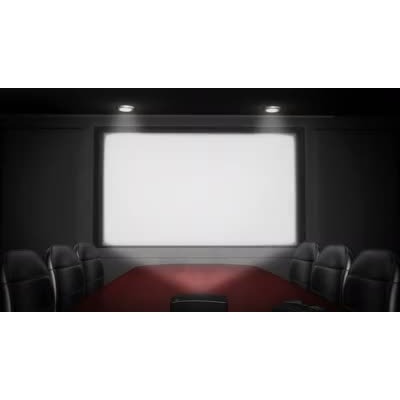 This video shows a business conference room with the lights low and a projector shining light onto a screen.