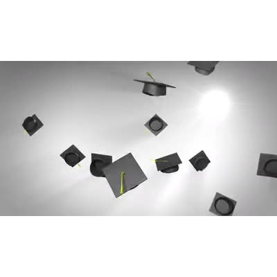 Graduation caps are tossed high into the air.