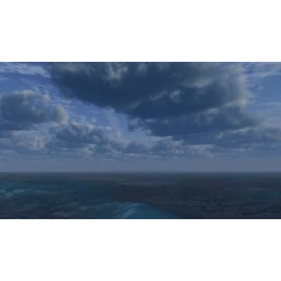 Ocean waves pass underneath this cloudy sky.