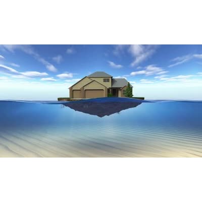 A house on a chunk of land sinks below the waves.