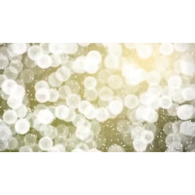 This video shows out of focus lights in the with light sparks falling.