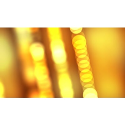 Yellow glowing beads of light across a golden background.