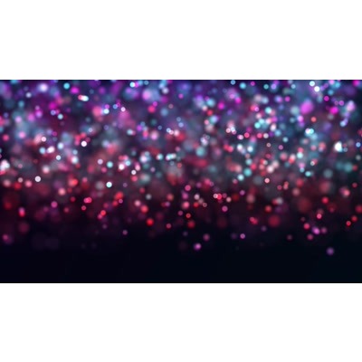 Multicolored particles floating around a blurry background.