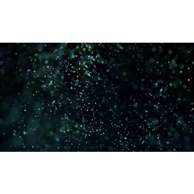 Particles floating across a dark background.