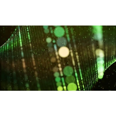 Spiraling emerald design over a darkened background. 