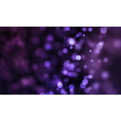 Purple blurry particles flow in this abstract video.