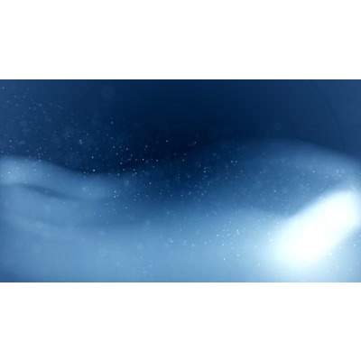 Sparkling particles light up this abstract video.