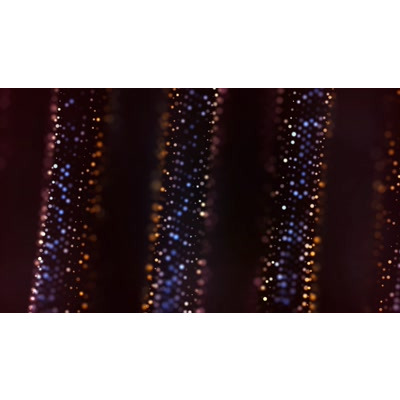 Colorful beads of light flow upwards on this abstract video.