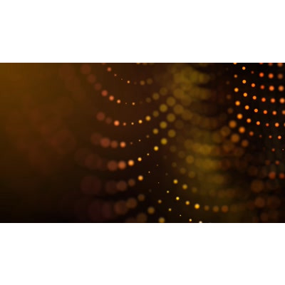 Glowing particles flow across this video background.