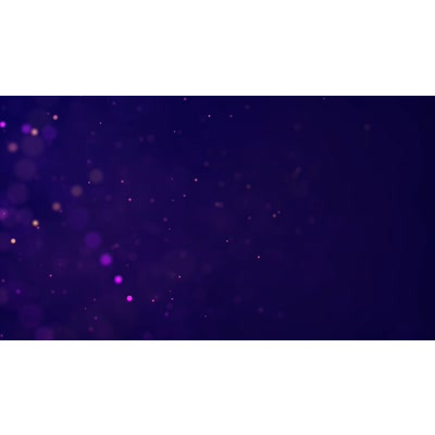 Flowing particles of light across this video background.