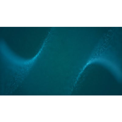 Glowing particles flow across this video background.