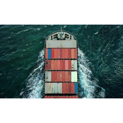 Download this video of a cargo ship highlighting its crucial role in global trade and vacation logistics.